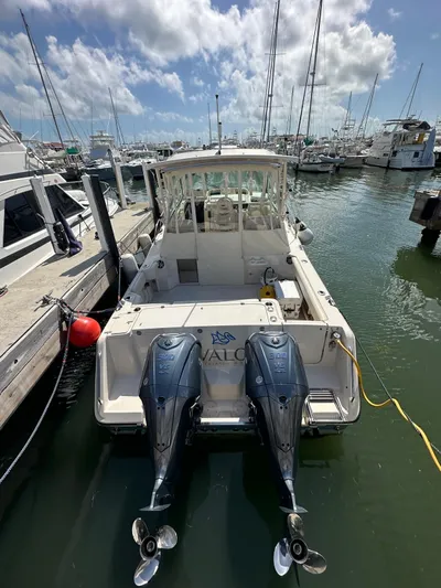  Yacht Photos Pics 2022 Grady-White Express 330 boat docked with twin outboard engines.
