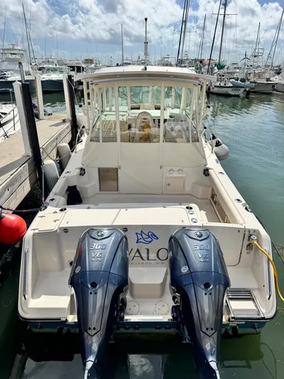  Yacht Photos Pics 2022 Grady-White Express 330 boat docked with twin outboard engines.