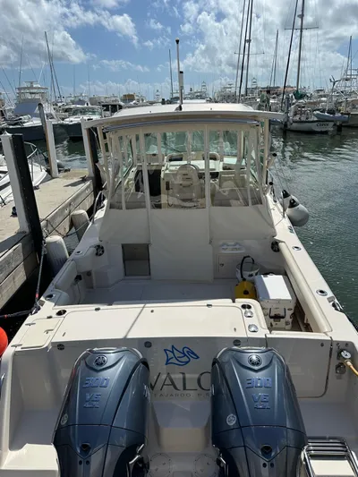  Yacht Photos Pics 2022 Grady-White Express 330 boat docked with twin engines, marina background.