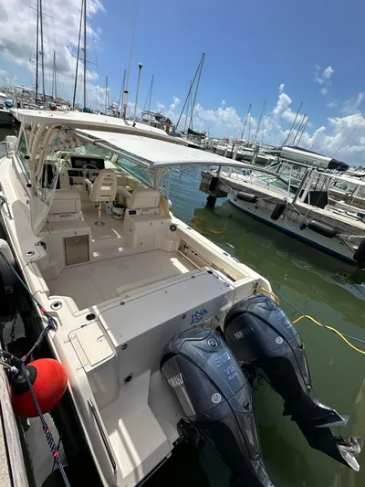  Yacht Photos Pics 2022 Grady-White Express 330 boat docked with twin outboard engines.