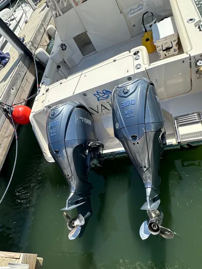  Yacht Photos Pics 2022 Grady-White Express 330 with dual Yamaha outboard motors docked at marina.