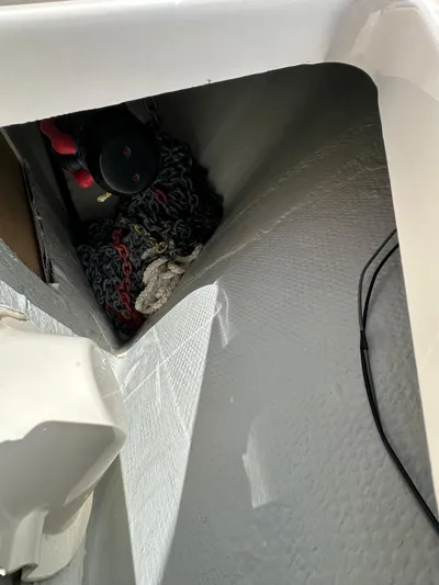  Yacht Photos Pics 2022 Grady-White Express 330 boat storage compartment with ropes and equipment.