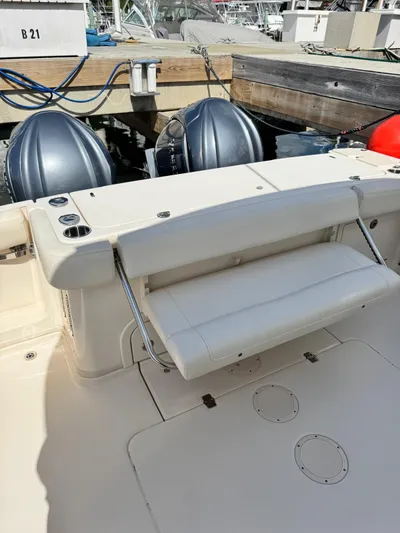  Yacht Photos Pics 2022 Grady-White Express 330 boat with dual outboard motors at dock.