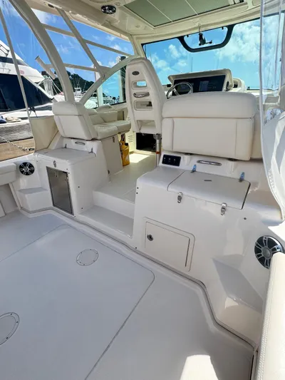  Yacht Photos Pics 2022 Grady-White Express 330 boat interior with white seating and modern dashboard.