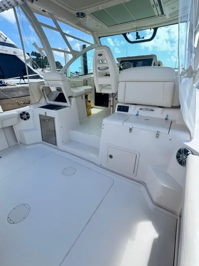  Yacht Photos Pics 2022 Grady-White Express 330 boat interior with white seating and modern controls.