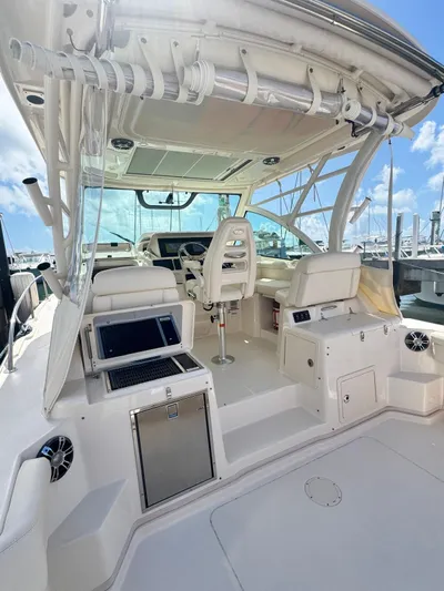  Yacht Photos Pics 2022 Grady-White Express 330 boat interior with helm, seating, and electronics.