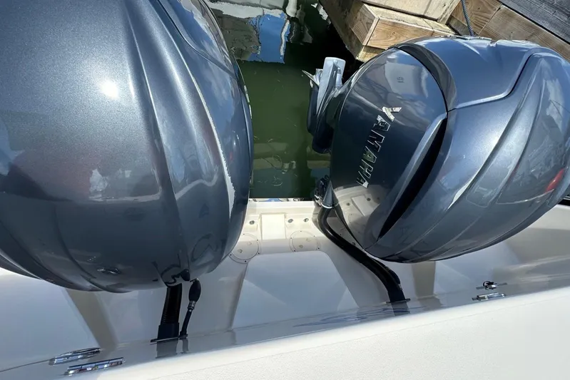  Yacht Photos Pics 2022 Grady-White Express 330 with twin outboard engines at dock.