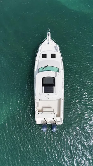  Yacht Photos Pics Aerial view of 2022 Grady-White Express 330 boat on clear water.