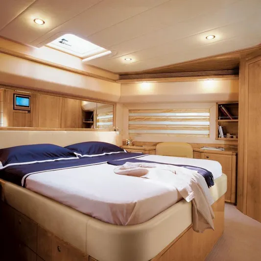Nm03008 Yacht Photos Pics Luxurious bedroom interior of 2008 Ferretti Yachts 881 with elegant wood finishes.