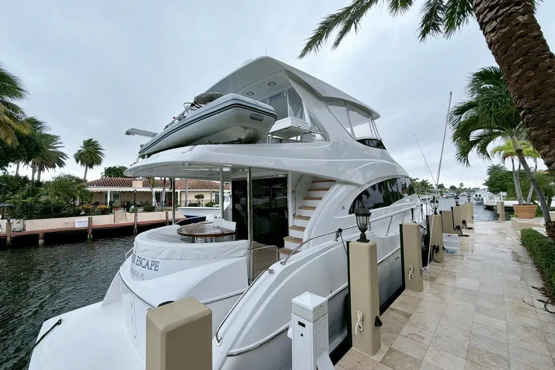 2024 Refit Yacht Photos Pics 2011 Hatteras 60 Motor Yacht docked, featuring sleek design and luxurious amenities.