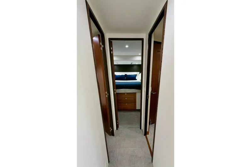 2024 Refit Yacht Photos Pics Hallway leading to a bedroom in a 2011 Hatteras 60 Motor Yacht.