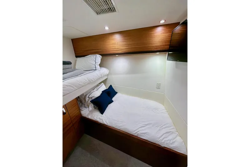 2024 Refit Yacht Photos Pics Cozy cabin with bunk beds in 2011 Hatteras 60 Motor Yacht.