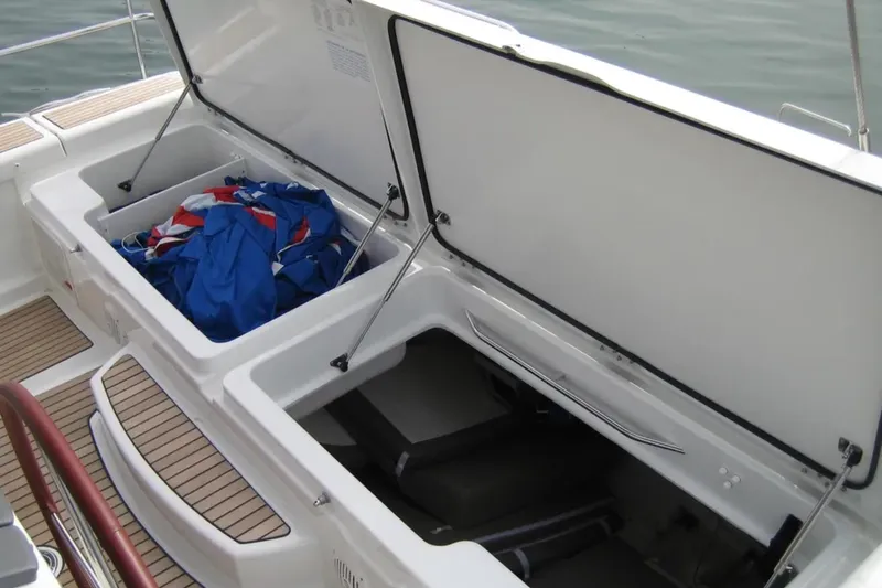 Motu Yacht Photos Pics Open storage compartments on a 2013 Jeanneau 57 yacht, featuring deck and equipment.
