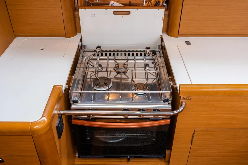 Motu Yacht Photos Pics Jeanneau 57 yacht kitchen with stove and oven, 2013 model.