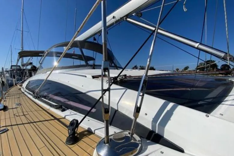 Motu Yacht Photos Pics 2013 Jeanneau 57 yacht with sleek deck design and modern rigging.