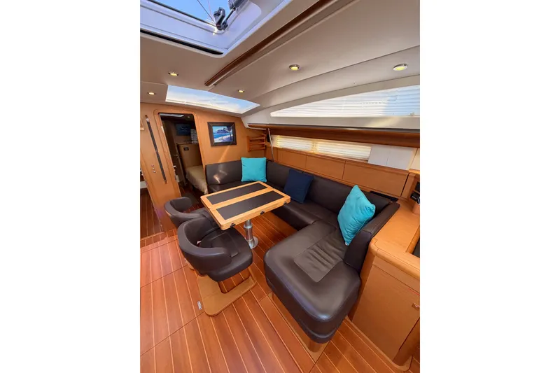Motu Yacht Photos Pics Luxurious interior of 2013 Jeanneau 57 yacht with elegant seating and modern design.