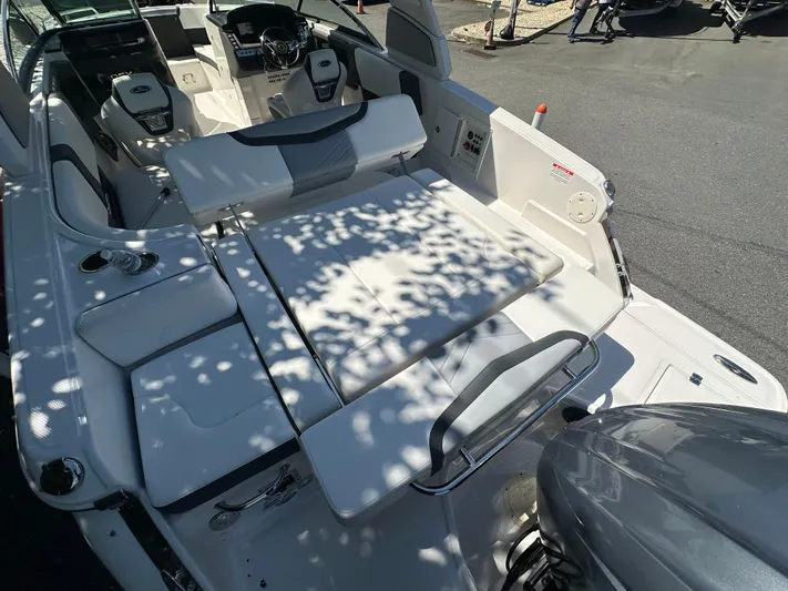  Yacht Photos Pics 2023 Chaparral 270 OSX boat interior with white seating and modern controls.