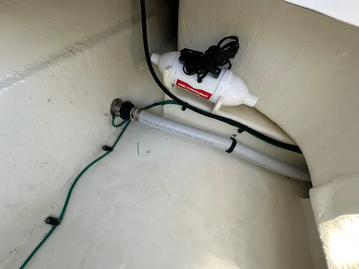  Yacht Photos Pics 2023 Chaparral 270 OSX boat interior showing plumbing and wiring components.