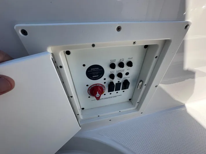  Yacht Photos Pics Control panel of 2023 Chaparral 270 OSX boat with switches and dials.