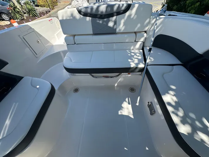  Yacht Photos Pics 2023 Chaparral 270 OSX boat interior with white seating and sleek design.