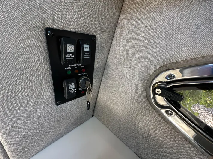  Yacht Photos Pics Control panel in 2023 Chaparral 270 OSX boat interior, featuring key ignition and switches.