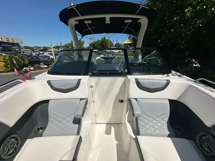  Yacht Photos Pics 2023 Chaparral 270 OSX boat interior with luxurious seating and modern design.