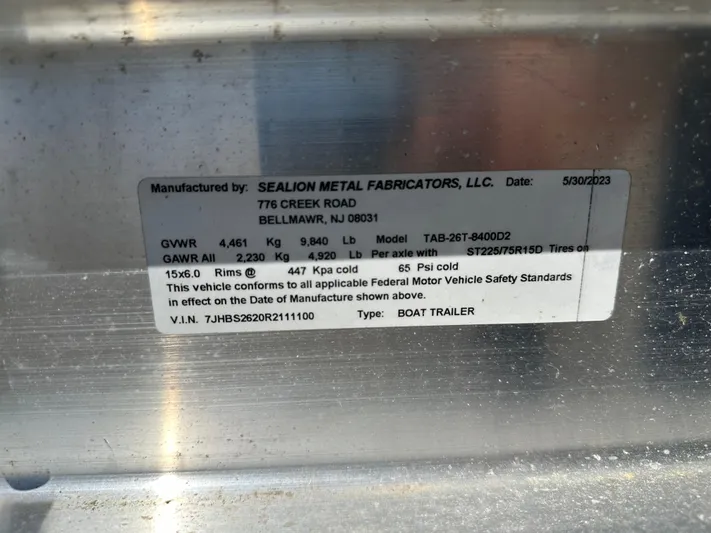  Yacht Photos Pics Label on boat trailer by Sealion Metal Fabricators, LLC, detailing specifications and compliance.