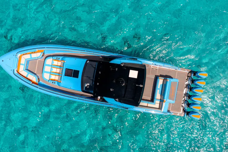  Yacht Photos Pics Aerial view of 2025 Cigarette 52 Thunder boat on clear turquoise water.