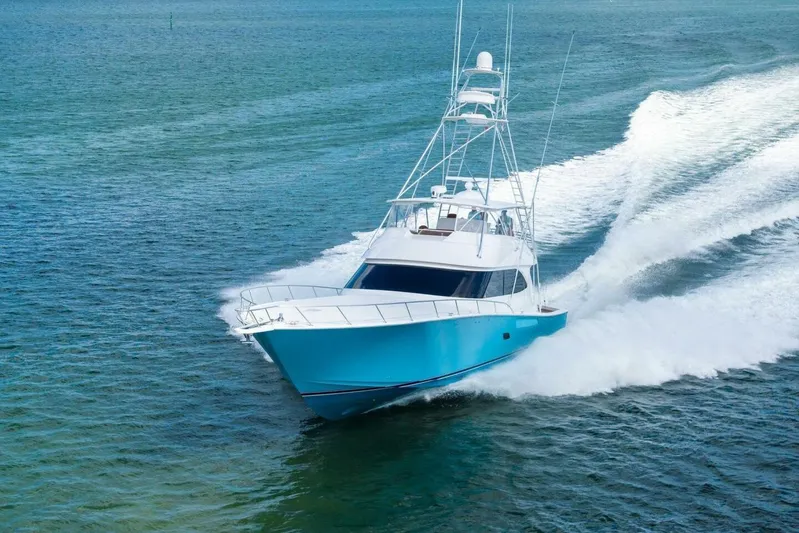 Lady Di Yacht Photos Pics 2012 Viking 82 Convertible yacht cruising swiftly on open water.