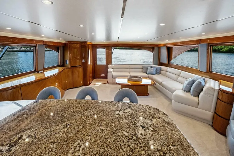 Lady Di Yacht Photos Pics Luxurious interior of 2012 Viking 82 Convertible yacht with elegant seating and granite table.