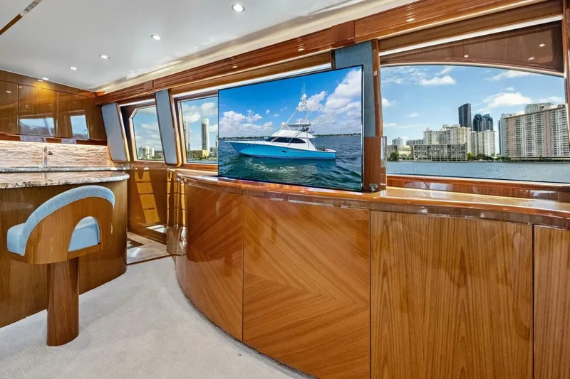 Lady Di Yacht Photos Pics Luxurious interior of 2012 Viking 82 Convertible yacht with city skyline view.