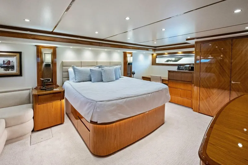 Lady Di Yacht Photos Pics Luxurious bedroom interior of 2012 Viking 82 Convertible yacht with elegant wood finishes.