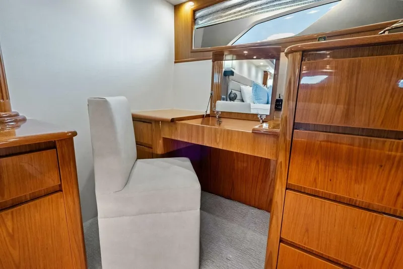 Lady Di Yacht Photos Pics Luxurious wooden vanity area inside 2012 Viking 82 Convertible yacht, featuring elegant design.