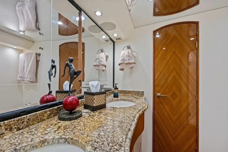 Lady Di Yacht Photos Pics Luxurious bathroom in 2012 Viking 82 Convertible yacht with granite countertop and elegant decor.