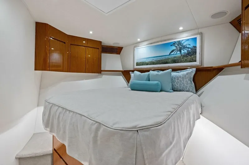 Lady Di Yacht Photos Pics Luxurious bedroom interior of 2012 Viking 82 Convertible yacht with elegant wood cabinetry.