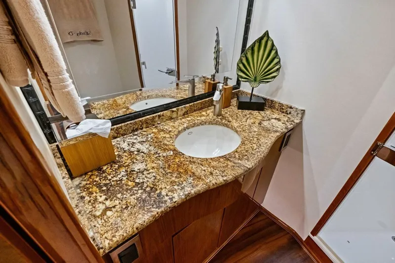 Lady Di Yacht Photos Pics Luxurious bathroom in 2012 Viking 82 Convertible yacht with granite countertop and elegant decor.