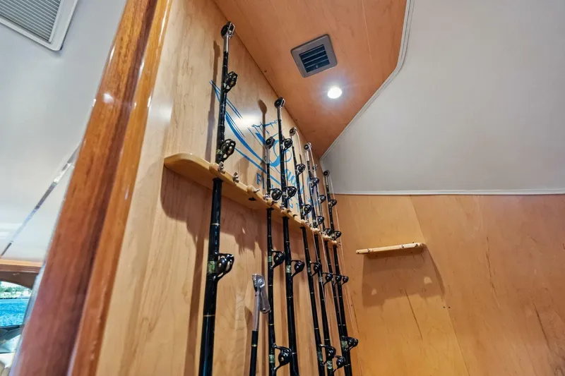 Lady Di Yacht Photos Pics Fishing rods stored vertically in a 2012 Viking 82 Convertible yacht interior.