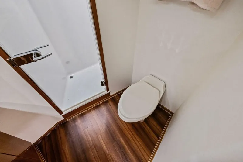 Lady Di Yacht Photos Pics Bathroom interior of 2012 Viking 82 Convertible yacht with shower and toilet.