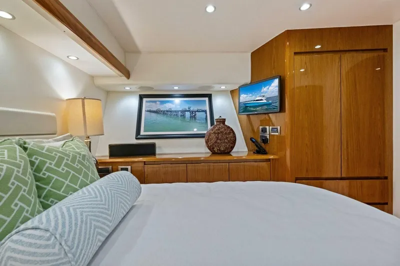 Lady Di Yacht Photos Pics Luxurious interior of 2012 Viking 82 Convertible yacht bedroom with modern decor.