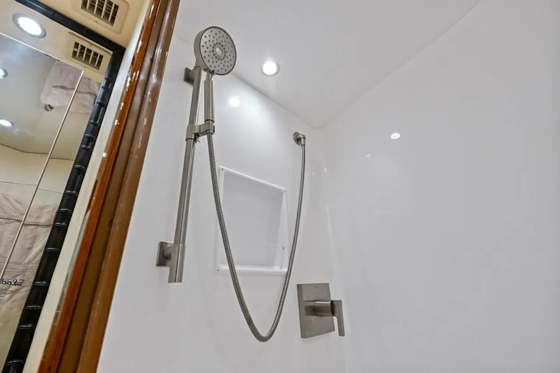 Lady Di Yacht Photos Pics Shower area in 2012 Viking 82 Convertible yacht, featuring modern fixtures and lighting.