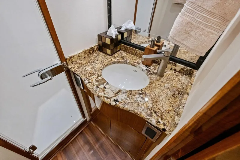 Lady Di Yacht Photos Pics Luxurious bathroom in 2012 Viking 82 Convertible yacht with granite countertop and modern fixtures.