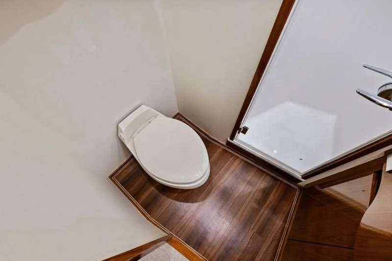 Lady Di Yacht Photos Pics Bathroom with wooden flooring in 2012 Viking 82 Convertible yacht.