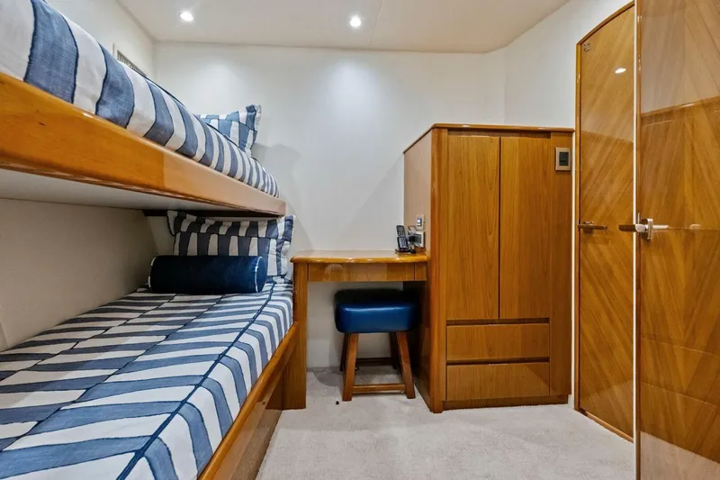 Lady Di Yacht Photos Pics Interior of 2012 Viking 82 Convertible yacht with bunk beds and wooden furnishings.