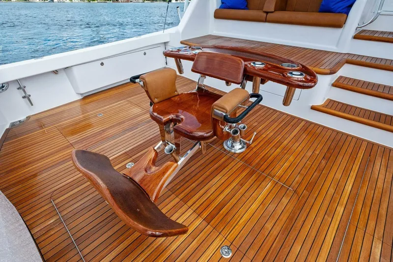 Lady Di Yacht Photos Pics Luxurious teak deck of 2012 Viking 82 Convertible yacht with fishing chair.