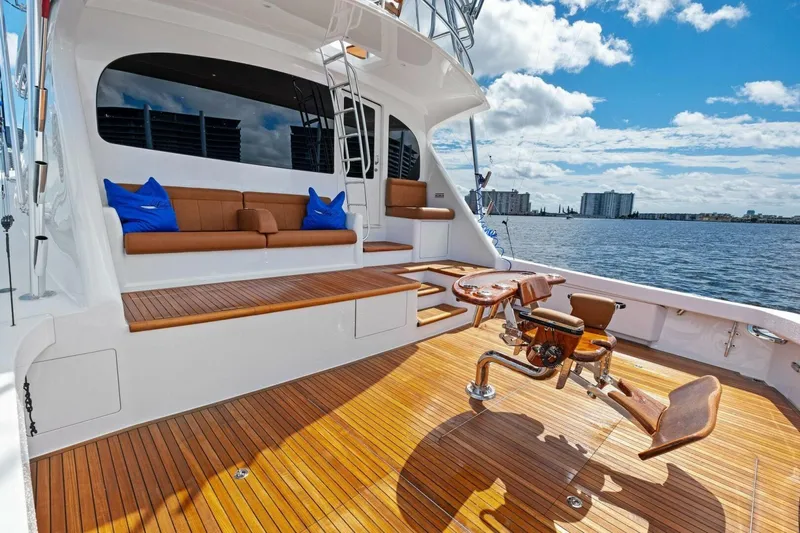 Lady Di Yacht Photos Pics Luxurious 2012 Viking 82 Convertible yacht deck with seating and fishing chair, overlooking the water.