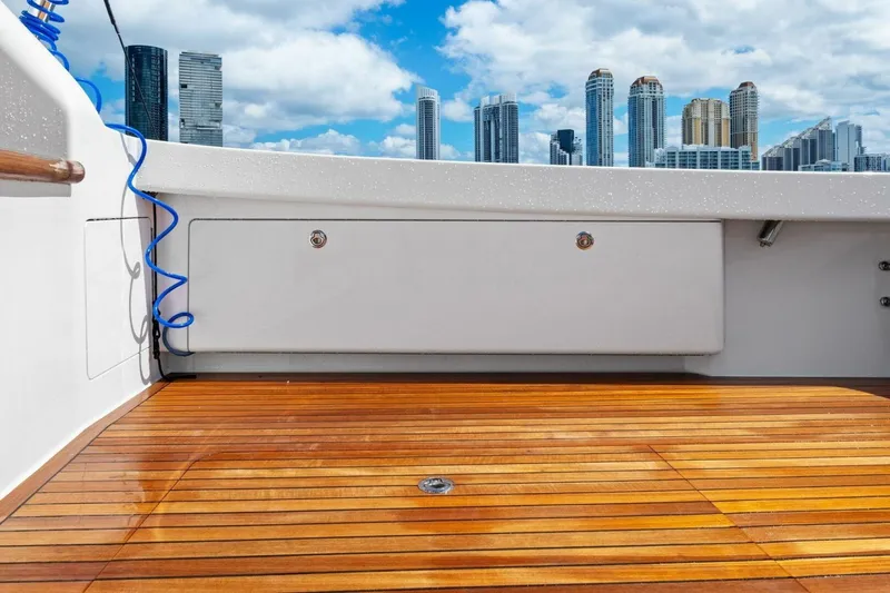 Lady Di Yacht Photos Pics 2012 Viking 82 Convertible yacht deck with city skyline in background.