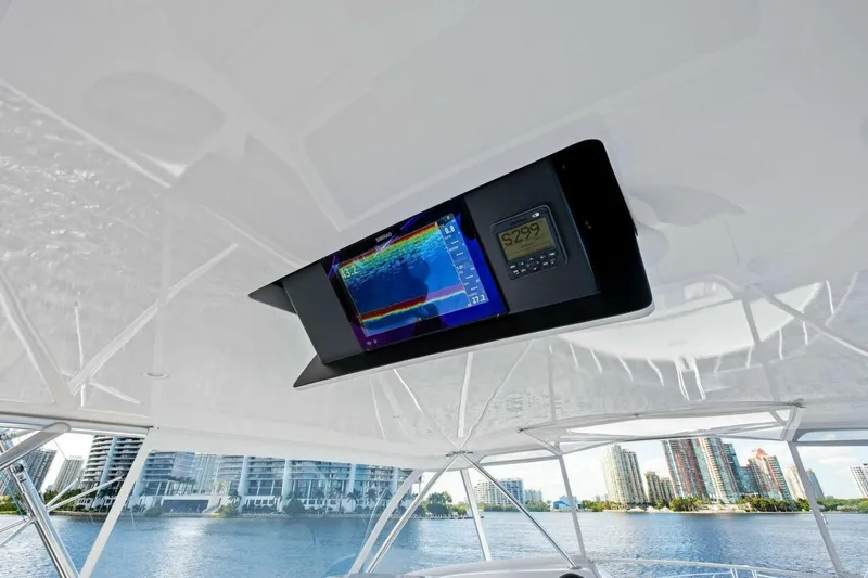 Lady Di Yacht Photos Pics Ceiling-mounted navigation display on 2012 Viking 82 Convertible yacht, with cityscape view.