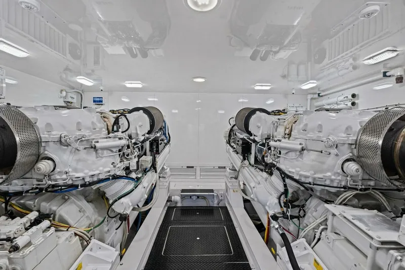 Lady Di Yacht Photos Pics Engine room of 2012 Viking 82 Convertible yacht, showcasing dual powerful engines.
