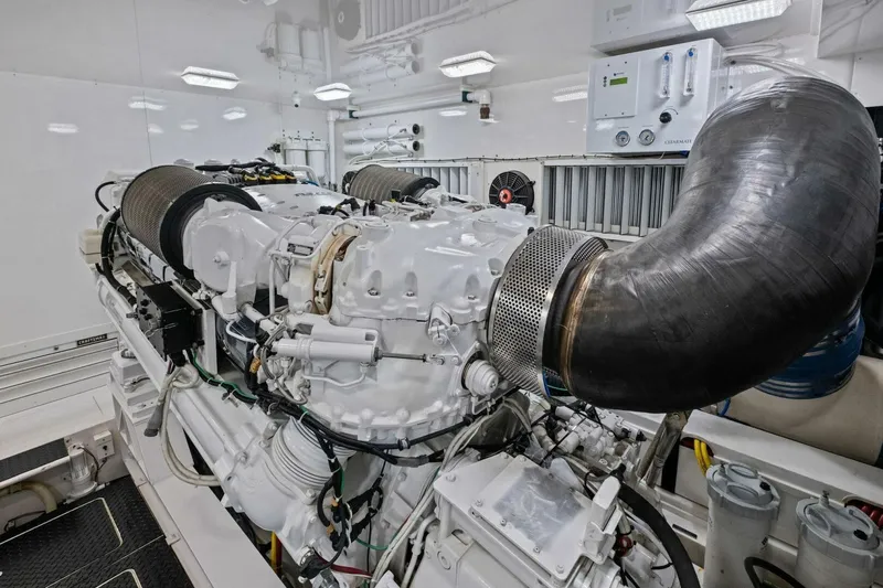 Lady Di Yacht Photos Pics Engine room of 2012 Viking 82 Convertible yacht, showcasing powerful machinery and components.