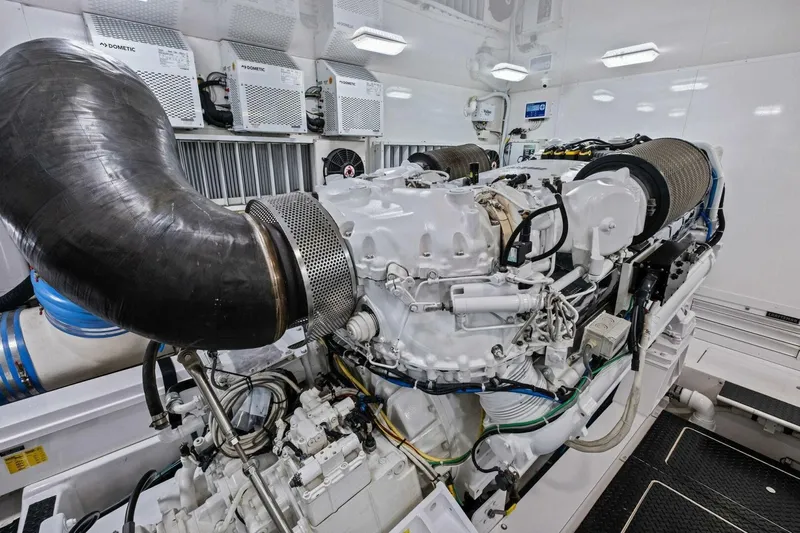 Lady Di Yacht Photos Pics Engine room of 2012 Viking 82 Convertible yacht, showcasing powerful machinery and components.